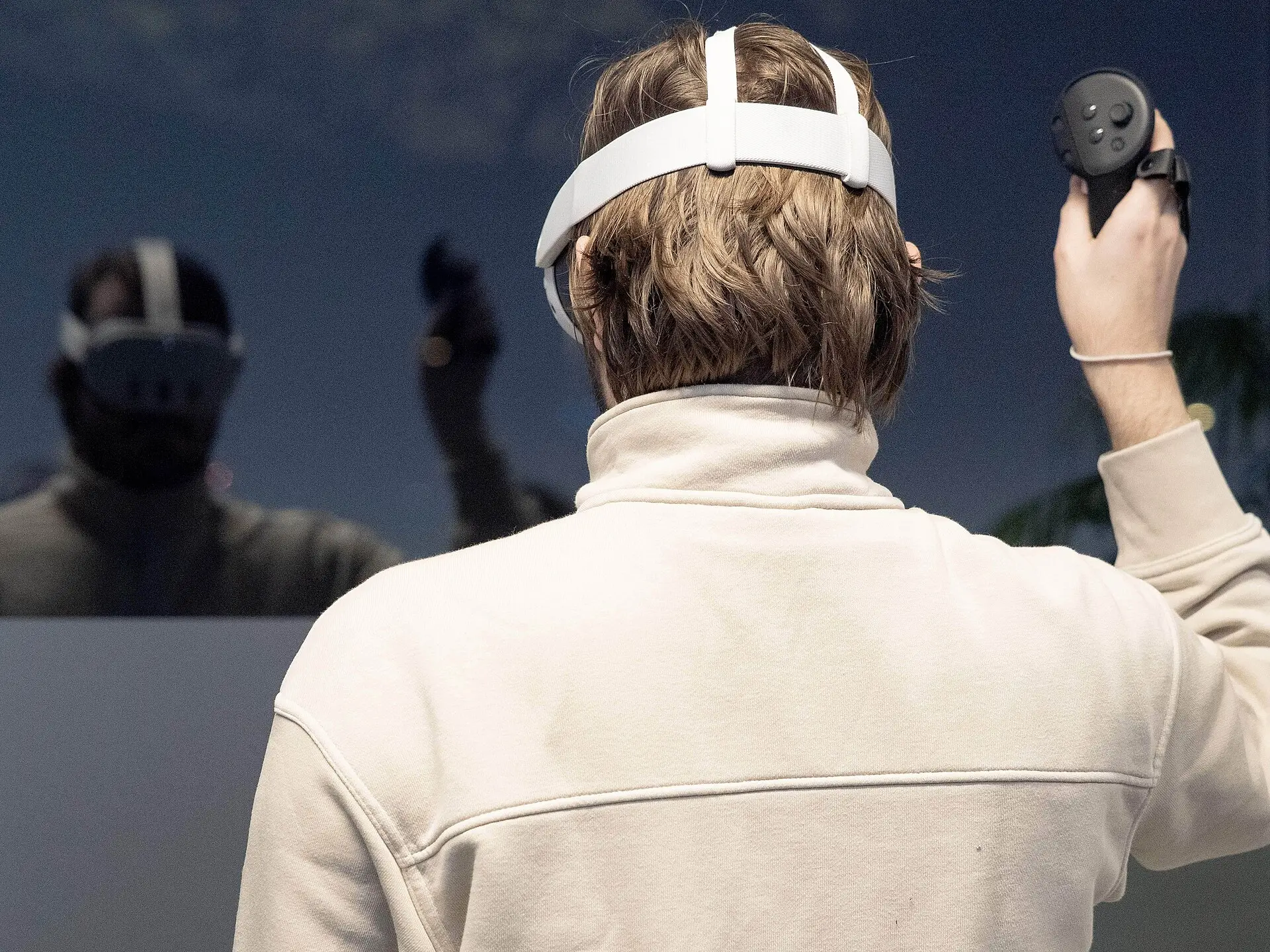 A person playing in VR wearing a headset